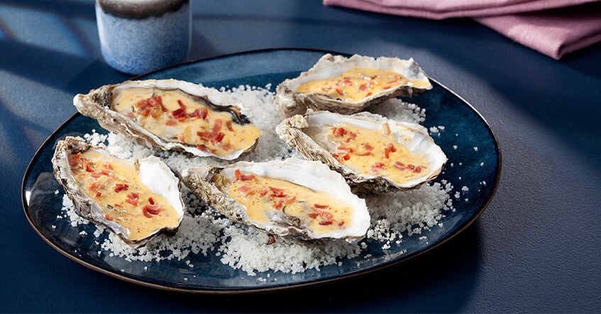 Ostras picantes con jamón de Bayona y nata espumosa con pimiento Espelette